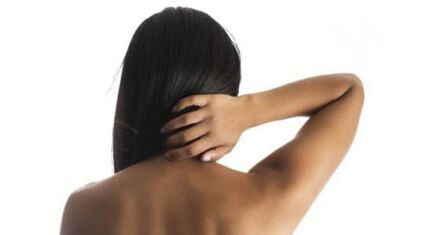 The girl shows her neck of the back of the back